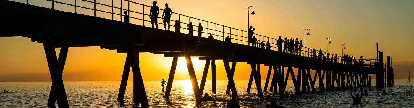 The sun setting over Glenelg Beach in Adelaide
