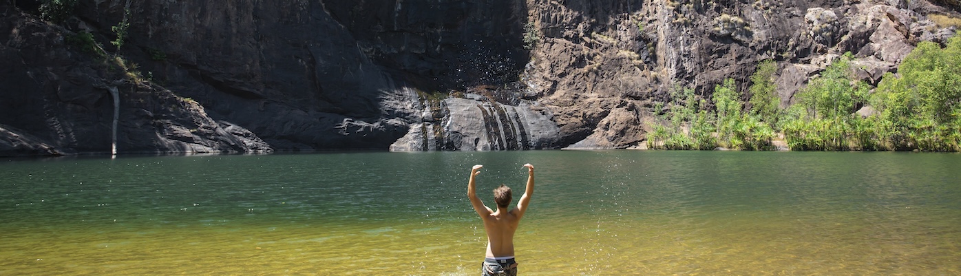 Guy splashing water at the bottom of Gunlom